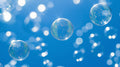 Bubble wallpaper mural creating a dreamy atmosphere in a modern living room with floating spheres against blue sky background
