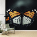 Butterfly wall mural creating dramatic impact in modern living room with dark furniture and warm lighting