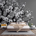 Black and white Cherry Blossom wallpaper creating a striking focal point in a modern Japanese-inspired living room