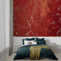 Cherry blossom wallpaper in red and gold creating drama in modern living room