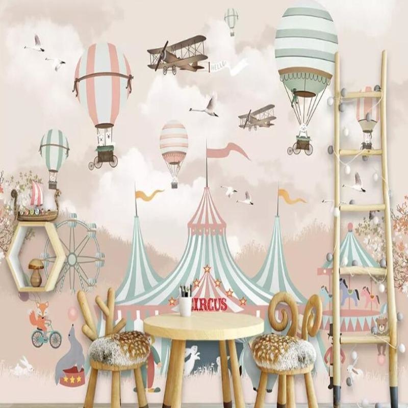 Circus theme wallpaper brings magic to a bright nursery, with soft pastel hot air balloons floating above vintage fairground tents