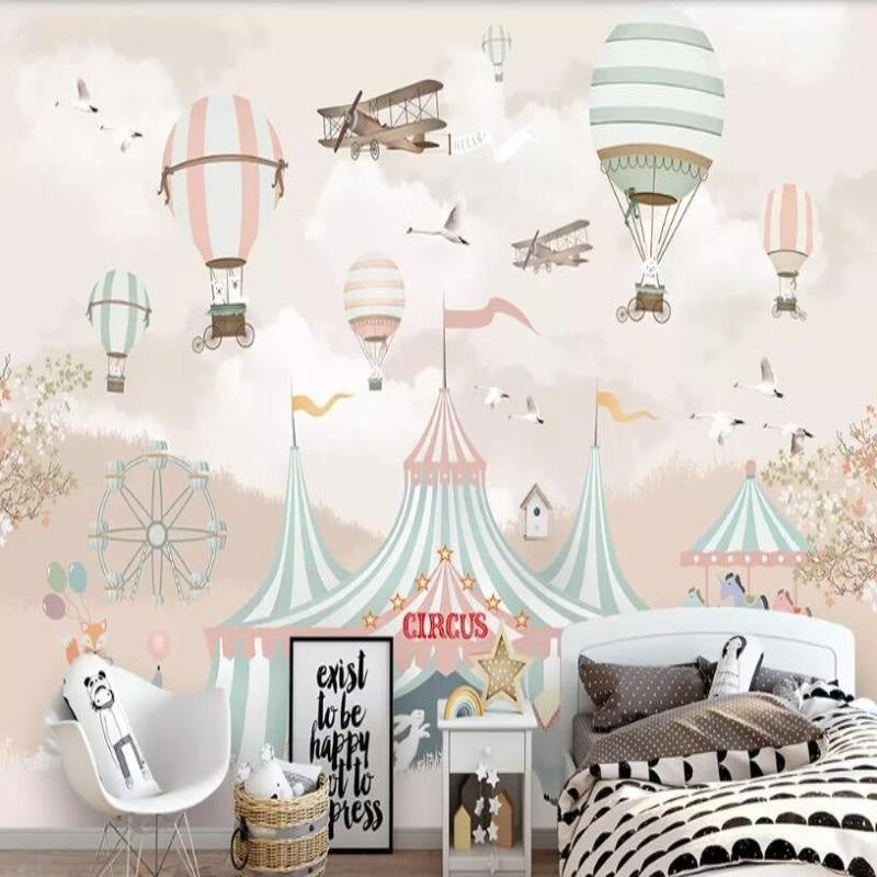 Carnival wallpaper transforms a bedroom with gentle mint and coral circus scenes and floating balloons