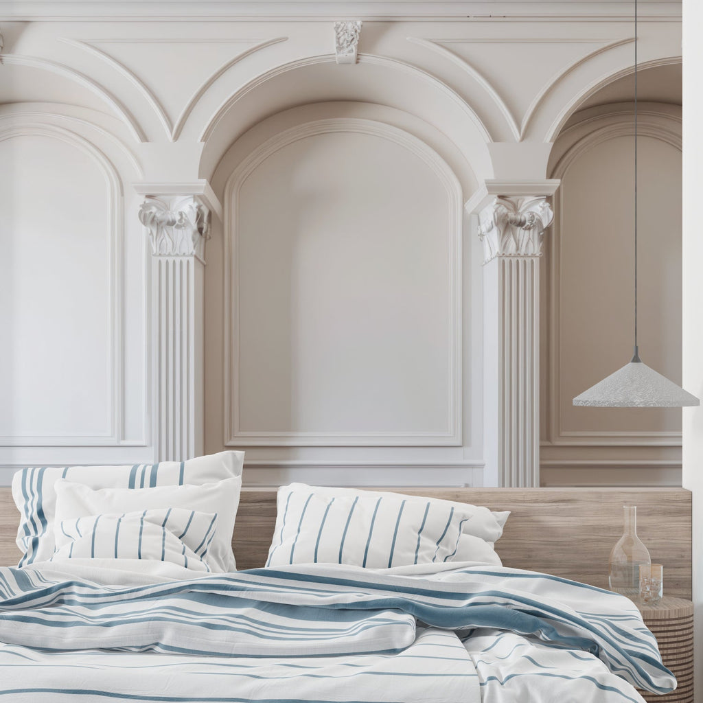 Classic arch mural wallpaper creating depth in a modern living room with white furniture and natural light