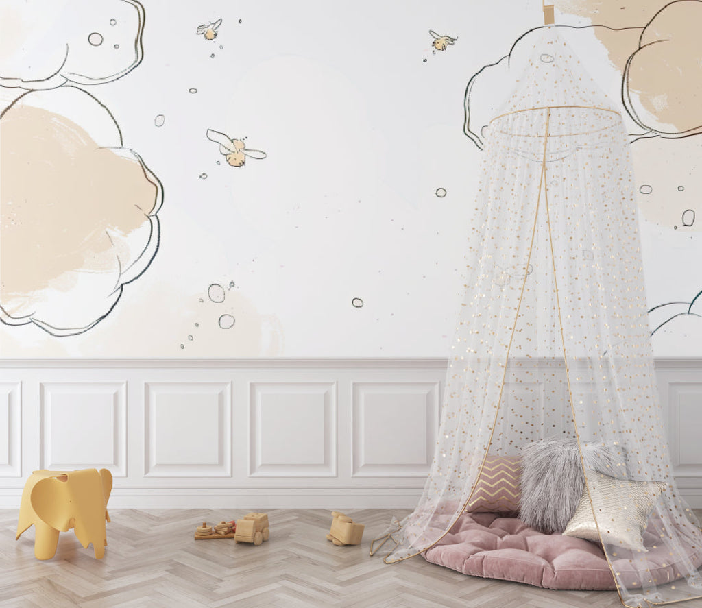 Baby room with cloud wallpaper featuring gentle bees, shown with wooden crib and soft textiles