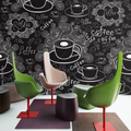Coffee shop wallpaper mural shown in modern kitchen space, creating an inviting cafe atmosphere with black and white design