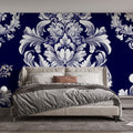 Blue and white damask wallpaper displayed in an elegant dining room with crystal chandelier and classic furniture