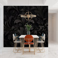 Black damask wallpaper creating elegant atmosphere in modern living room with gray sofa and brass accents