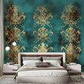 Gold and turquoise damask wallpaper in an elegant dining room with crystal chandelier and classic furniture