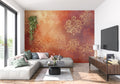 Damask wallpaper in gold and terracotta tones adding warmth to a modern living room setting