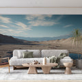 Desert landscape wallpaper with blue lakes creating depth in modern living room, natural light highlighting mountain peaks