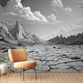 Black and white desert landscape mural wallpaper in modern minimalist living room with clean furniture and natural light