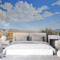 Desert landscape wallpaper creates a peaceful atmosphere in a modern living room with neutral furniture