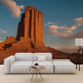 Desert landscape wallpaper creating depth in a modern living room, warm terracotta tones complementing contemporary furniture