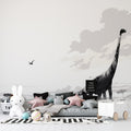 Black and white dinosaur wallpaper mural in modern nursery, showing diplodocus silhouette against peaceful savanna backdrop
