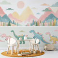 Dinosaur wallpaper with pastel mountains creating a sweet atmosphere in a modern nursery with white furniture