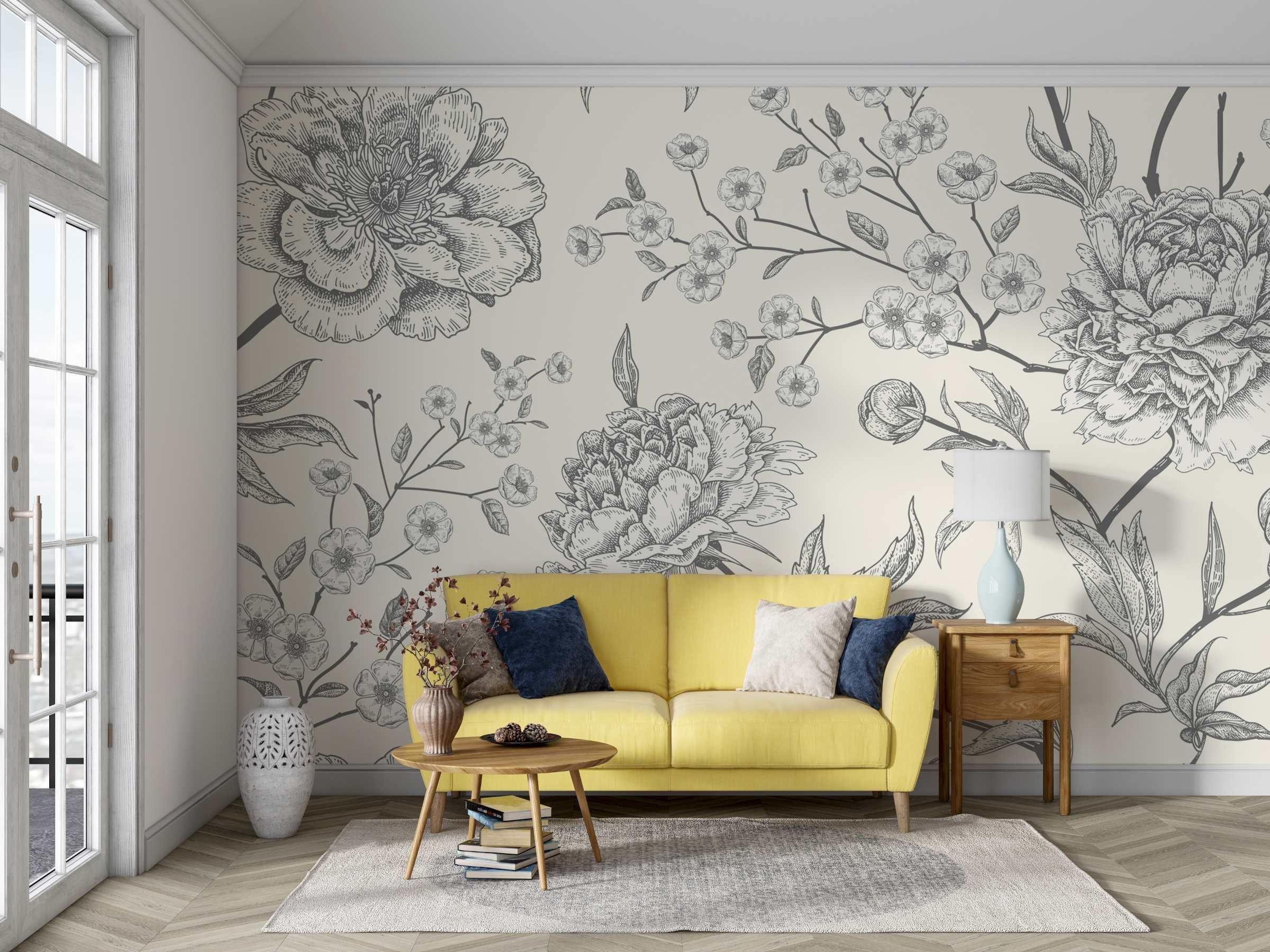 Black and white botanical sketch wallpaper in modern living room showing delicate floral pattern against light walls