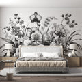 Black and white orchid wallpaper mural creating an elegant statement wall in a modern dining room with minimalist furniture