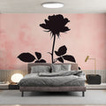 Black Rose Silhouette Wallpaper creating a stunning accent wall in a modern bedroom with pink and gray decor
