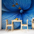 Blue and gold abstract floral wallpaper creating a peaceful atmosphere in a modern living room with minimal furniture