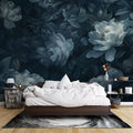 Dark blue peony wallpaper in modern living room with grey sofa and natural light