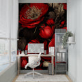 Red rose wallpaper mural creating drama in a modern living room with black furniture