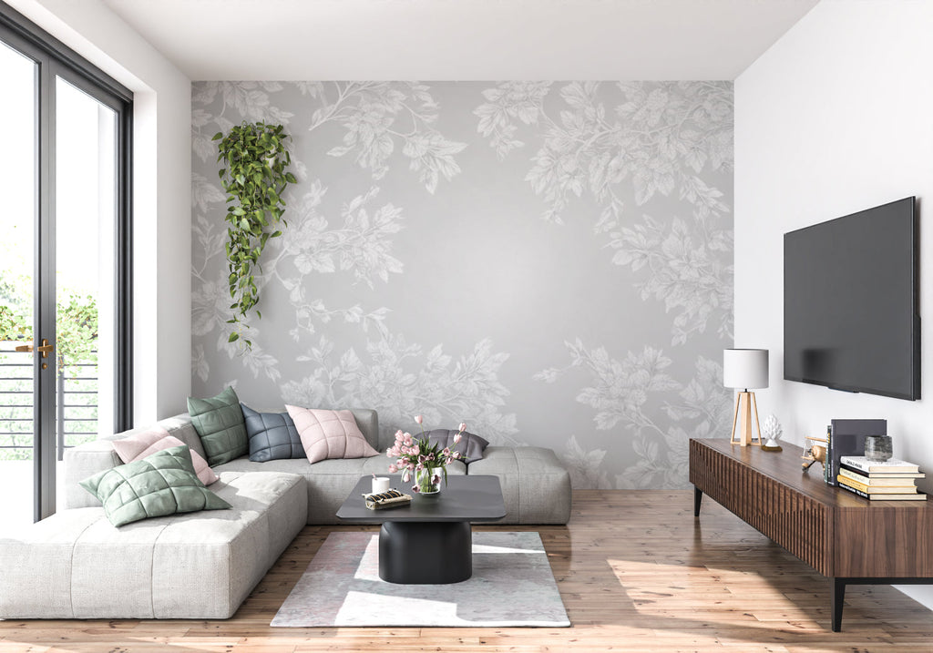 Elegant grey leaf pattern wallpaper in a cozy bedroom setting with soft furnishings