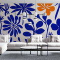 Modern floral wallpaper with blue and orange blooms creating a stunning accent wall in a bright living room
