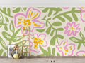 Pink and green Floral Mural Wallpaper creating a bright, airy atmosphere in a modern living room setting