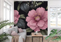 Pink floral wallpaper mural creating a dramatic accent wall in modern living room with grey sofa