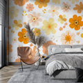 Retro floral wallpaper bringing warmth to a modern living room with orange and yellow blooms