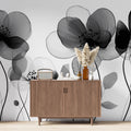 Modern black and white floral wallpaper creating a peaceful atmosphere in a minimalist bedroom with natural light