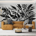 Black and white botanical wallpaper creating dramatic impact in a modern living room with minimalist furniture
