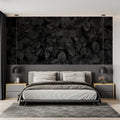 Black and white leaf wallpaper in modern living room creating dramatic focal point