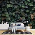 Green and gold leaf wallpaper creating a luxurious atmosphere in a modern living room with natural light