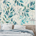 Turquoise and sage botanical wallpaper in modern living room with grey sofa and natural light