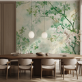 Green foliage wallpaper in bright modern living room showing watercolor branches pattern