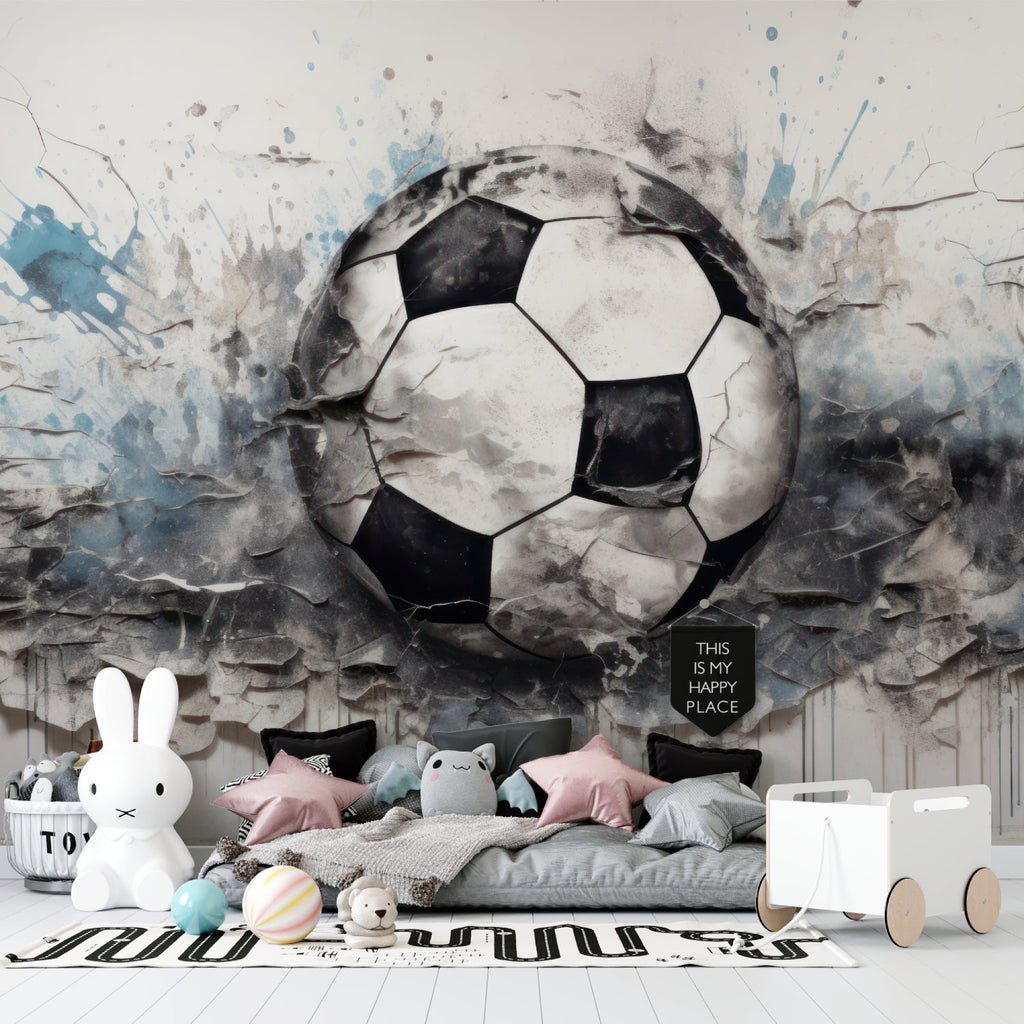 Kids room featuring football breaking through wall mural with bed setup