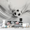 Modern Football wallpaper in teen bedroom showing 3D soccer ball design above gaming setup