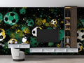 Football mural wallpaper in modern gaming room with green and gold cosmic design creating an epic atmosphere