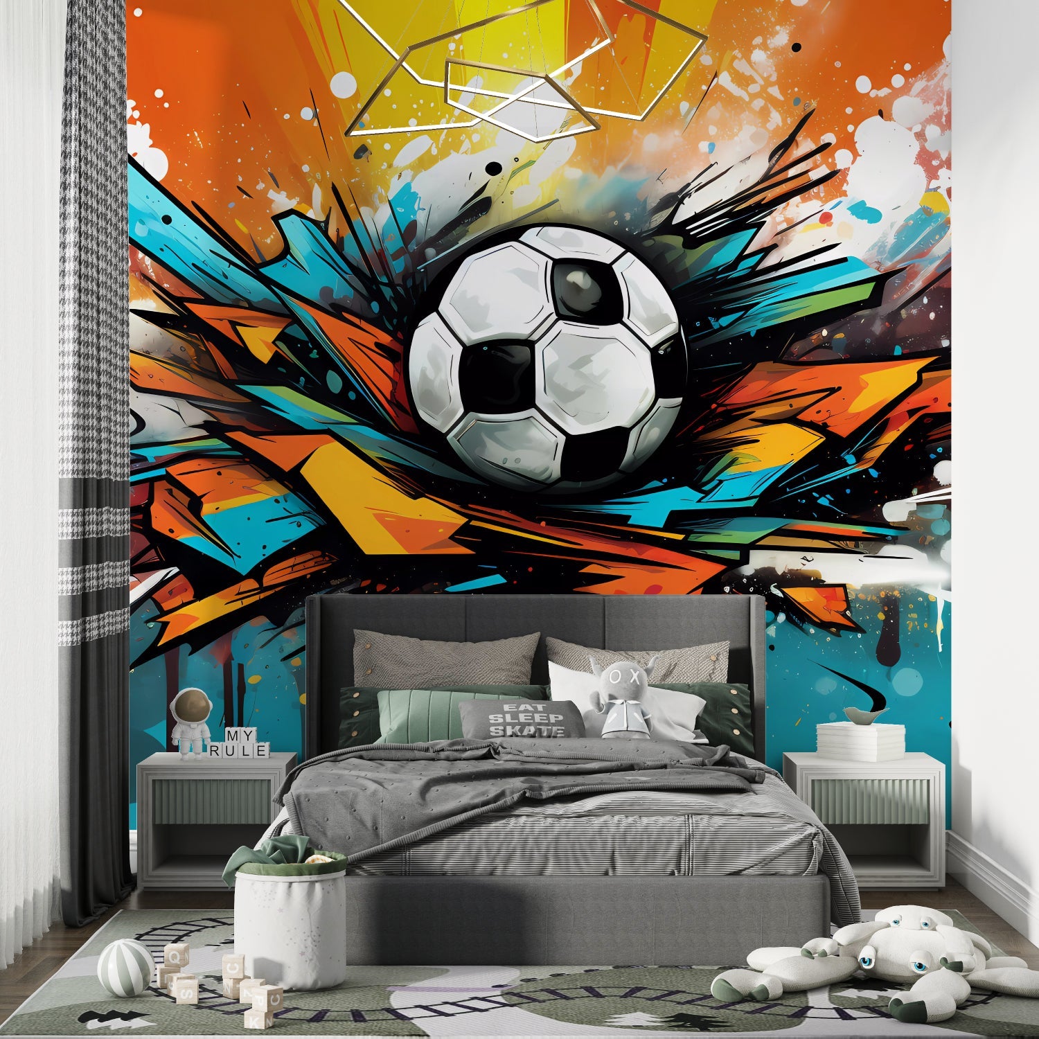 Soccer wall mural in sports themed kids room with training equipment