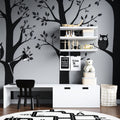 Black and white forest animals wallpaper creating a cozy atmosphere in a modern nursery
