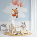 Flying Fox nursery wallpaper in a cozy reading nook with rocking chair and soft lighting