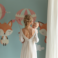 Forest Animals Wallpaper in cozy nursery with rocking chair and soft lighting, showing floating fox and pink balloons
