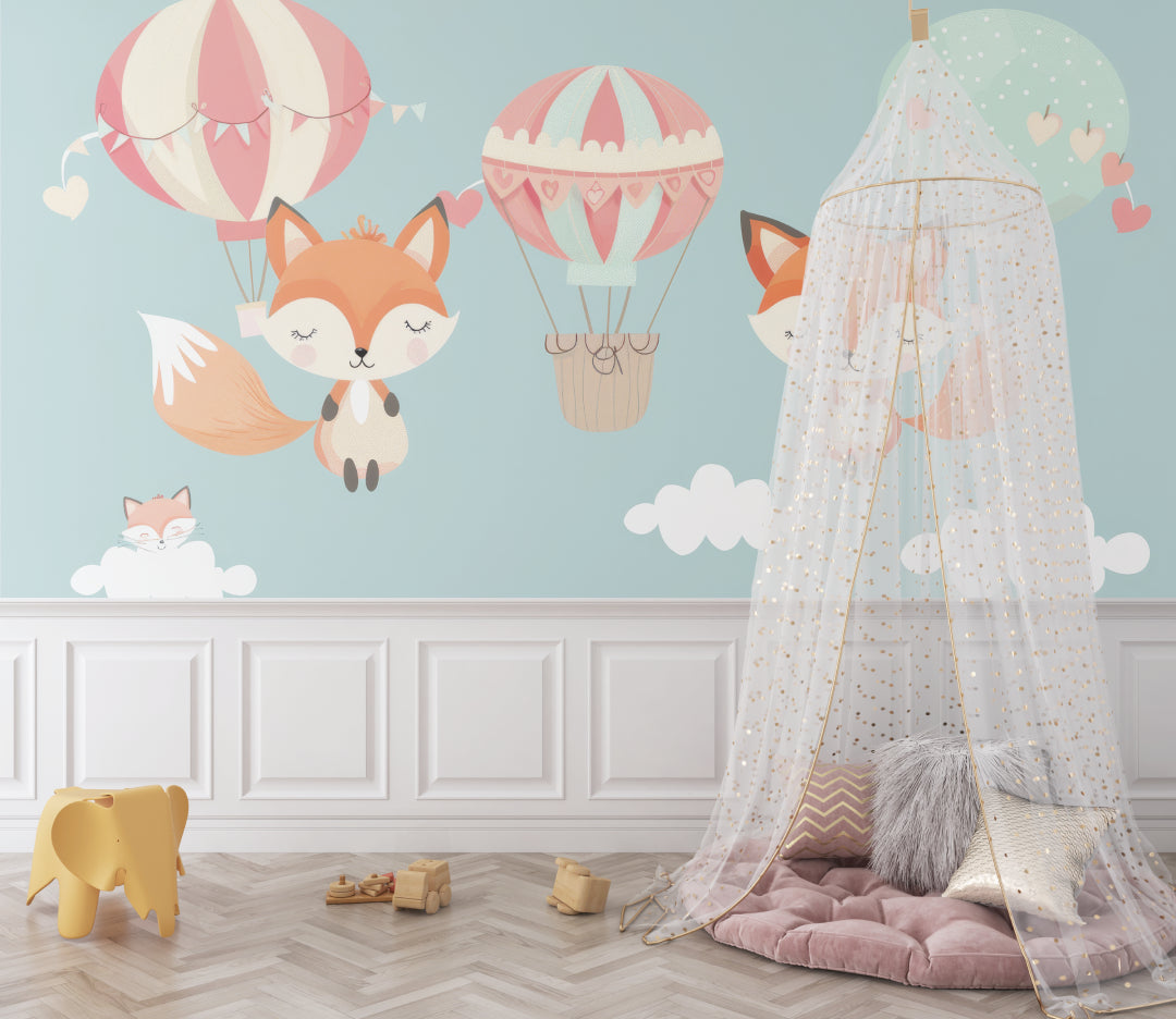 Kids room wall mural featuring fox and balloons, styled with white furniture and pink accents
