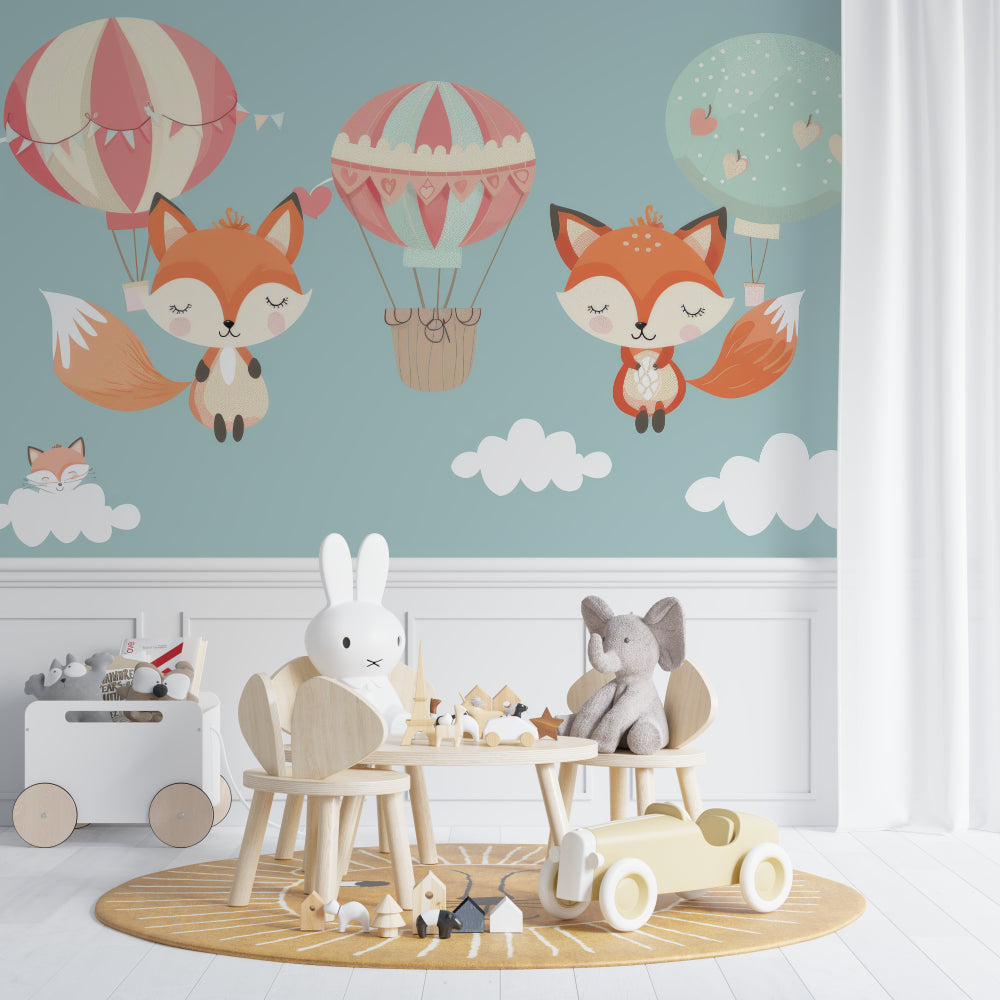 Hot air balloon wallpaper in toddler bedroom with play area and soft toys