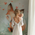 Forest fox wallpaper styled in a modern nursery with white furniture and soft pink accents