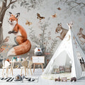 Forest animals wallpaper in a bright modern nursery with white furniture and natural decor