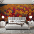 Autumn forest wallpaper creating a cozy atmosphere in modern living room with red and gold leaf details
