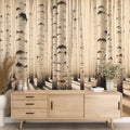 Birch forest wallpaper in sepia tones creating a cozy atmosphere in a modern living room with natural light