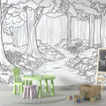 Black and white forest path wallpaper creating depth in a modern living room with minimal furniture